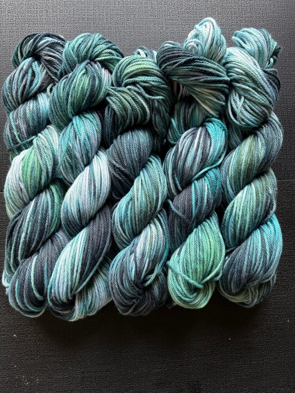 cunning serpent yarn – hand-dyed variegated green, grey & black skein for knitting & crochet